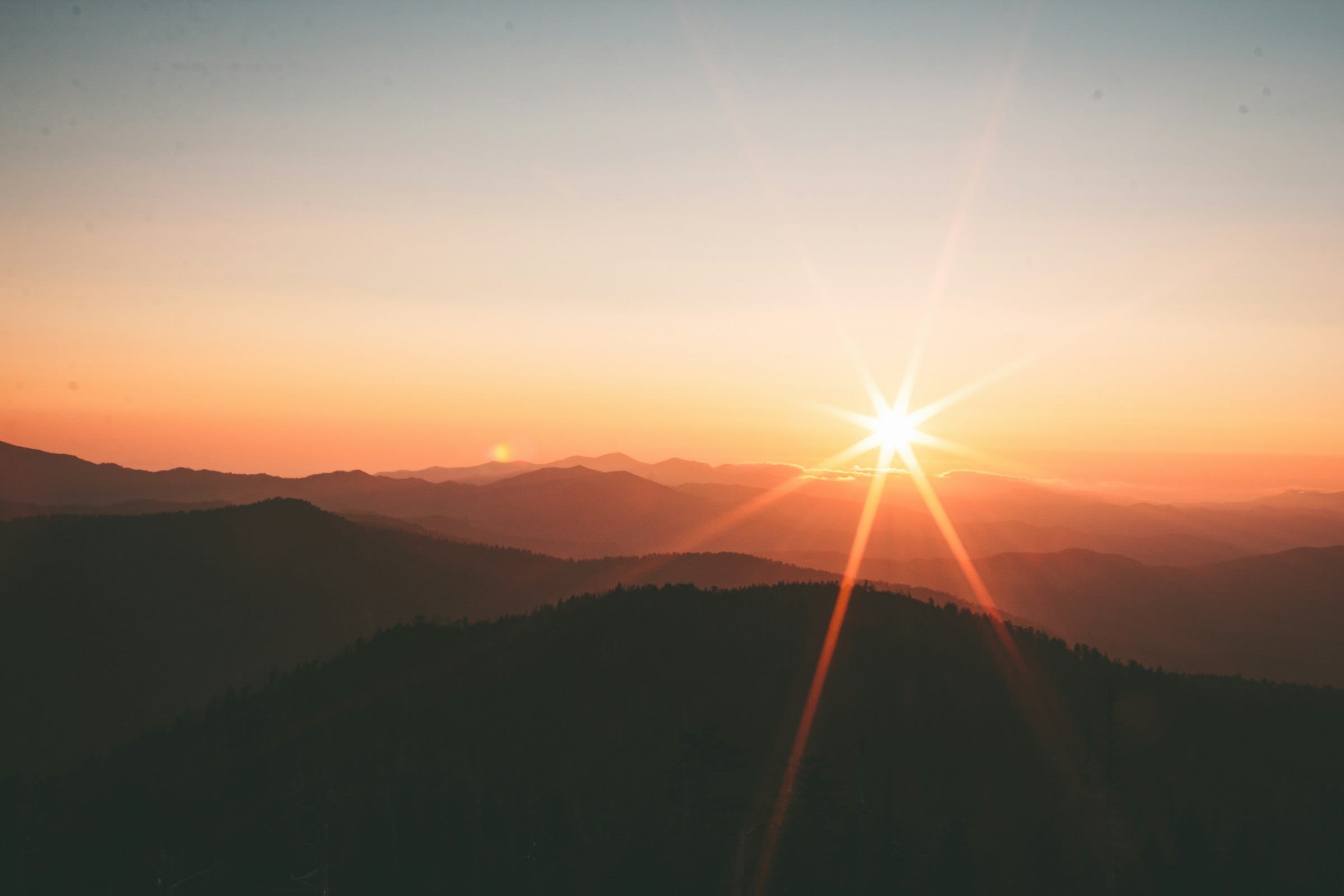 Sunrise over calm mountains